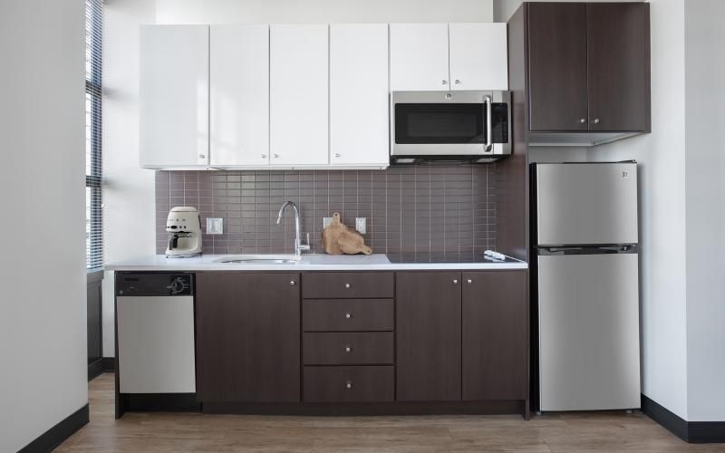 a kitchen with white cabinets