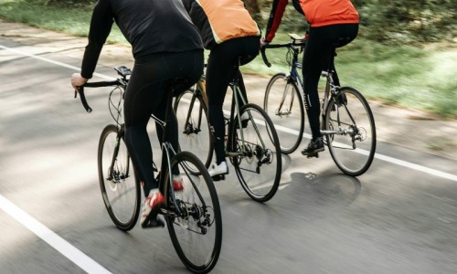 a group of people riding bikes